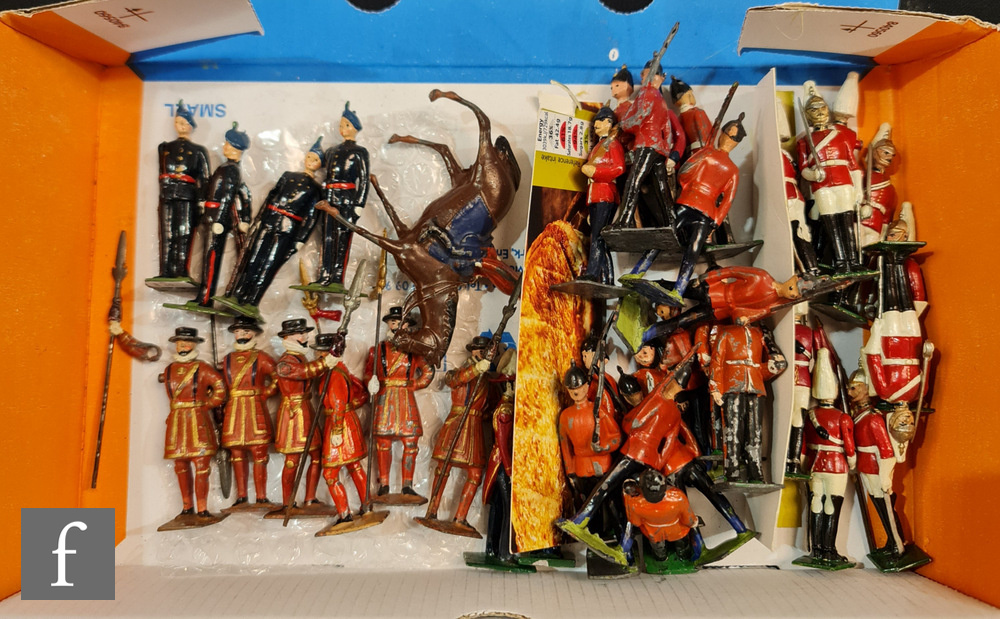 Twenty Britains hollowcast toy soliders, set 1475 comprising seven Beefeater Yeoman Warders, set