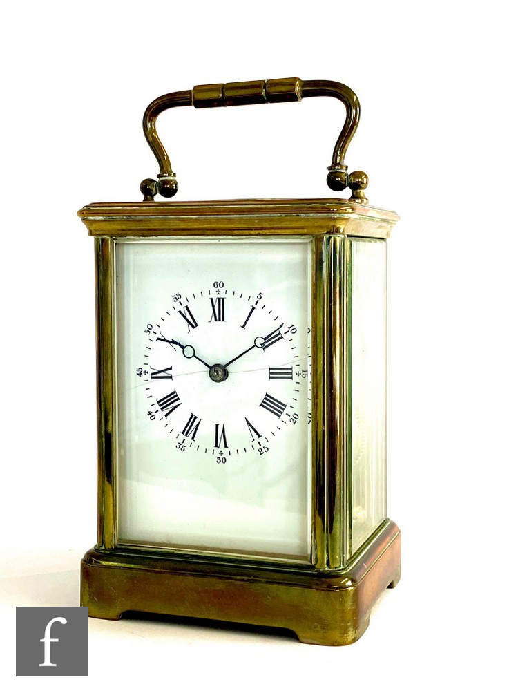 A 20th Century brass carriage clock, white enamel dial on bracket plinth base, height 13cm, S/D.