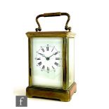 A 20th Century brass carriage clock, white enamel dial on bracket plinth base, height 13cm, S/D.