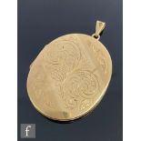 A 9ct hallmarked oval locket with part foliate engraved decoration, length 5cm, weight 19g,