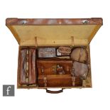 A collection of early 20th Century gentleman's travelling accessories to include a leather cased