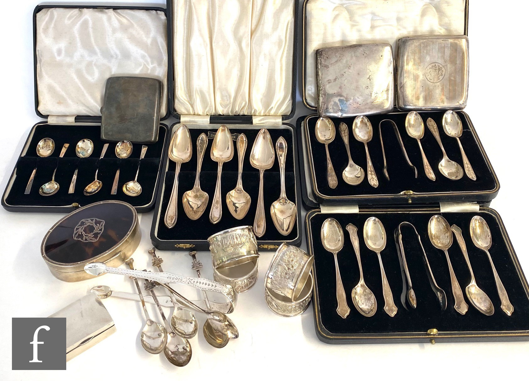A small parcel lot of assorted silver to include four cased sets of spoons, various other