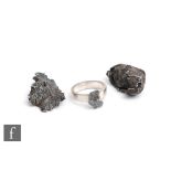 A ring, a pendant and a piece of raw meteorite all from the 1947 crash in Siberia of the Sikhote-