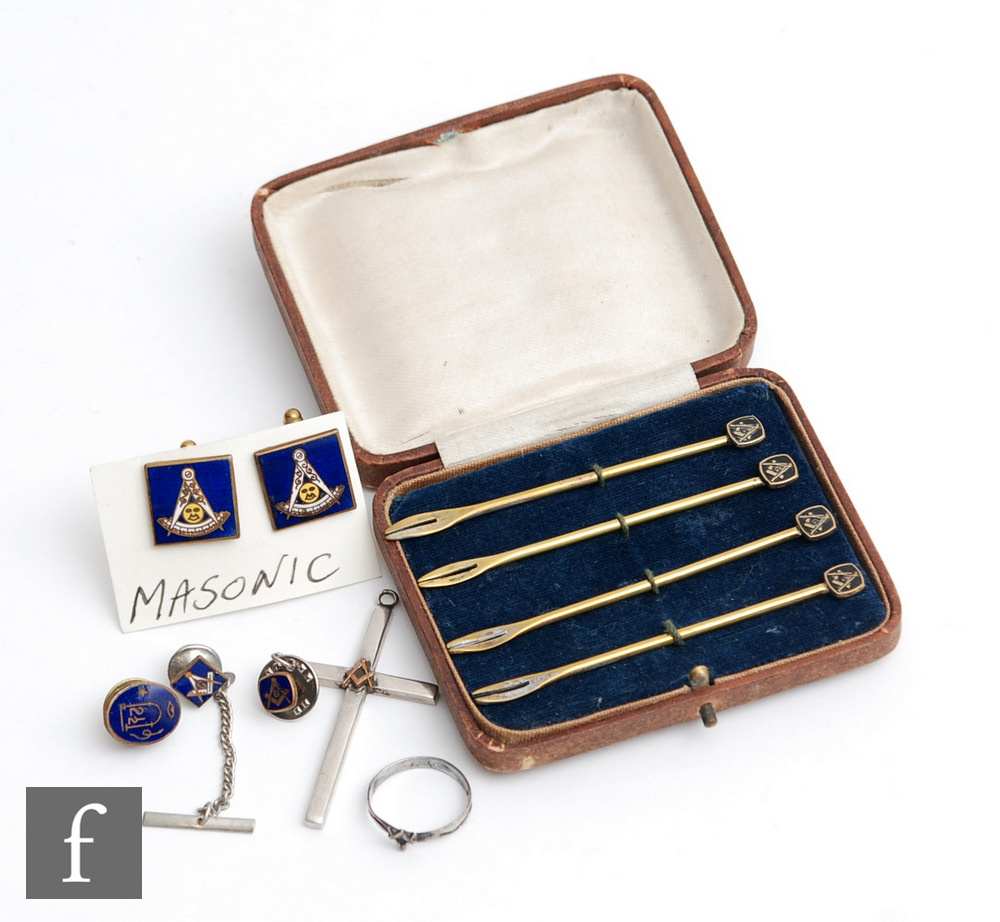 A Masonic silver cross with compass mount, a silver finger ring, a pair of enamelled cuff links,