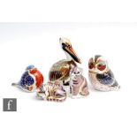 Five assorted Royal Crown Derby paperweights comprising a Brown Pelican, a Tawny Owl, a robin,