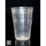 A large 18th Century tumbler with upper foliate engraved band above a deep basal moulded band,