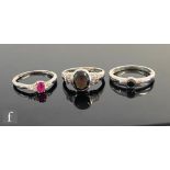 Three 9ct hallmarked 9ct white gold set rings to include hematite and ruby examples, total weight