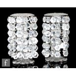 A pair of 19th Century clear crystal table lustres with a petal edged base and baluster and