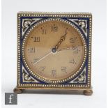 An early 20th Century alarm clock, Arabic numerals to a champagne circular dial all within an