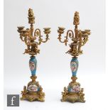 A pair of late 19th Century French serves style candelabrum, the triple branch sconces over three