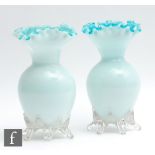 A pair of large late 19th Century glass vases of shouldered ovoid form with collar neck and