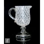 A late 18th Century continental jug, possibly Spanish, the ovoid bowl with integral lip and