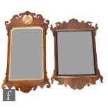 An early 19th Century Chippendale style parcel gilt mahogany wall mirror, the rectangular plate