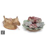 An early 20th Century French two part mould modelled as a dog, the terracotta glazed to the