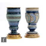 Two late 19th to early 20th Century Doulton Lambeth pedestal vases or oil lamp bases, each with