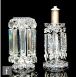 A 19th Century clear crystal table lustre with petal edged domed foot and hollow blown stem rising