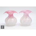 A pair of late 19th Century posy vases of ovoid form with a narrow neck and petal edged rim with a