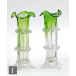 A pair of late 19th Century posy vases of fluted sleeve form with triform rim, decorated with