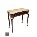 A George III mahogany card table, the shaped top opening to reveal a dished sectioned interior,