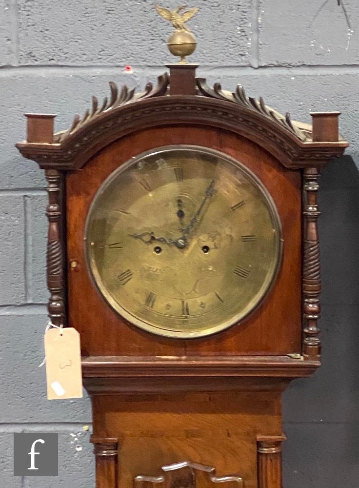 A Regency style mahogany longcase clock with an associated eight-day movement striking on a bell,