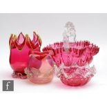 A collection of late 19th Century cranberry glass to include a large rustic handled basket, preserve