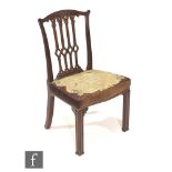 A George III mahogany standard chair, the four pierced splats below a bow top rail, floral