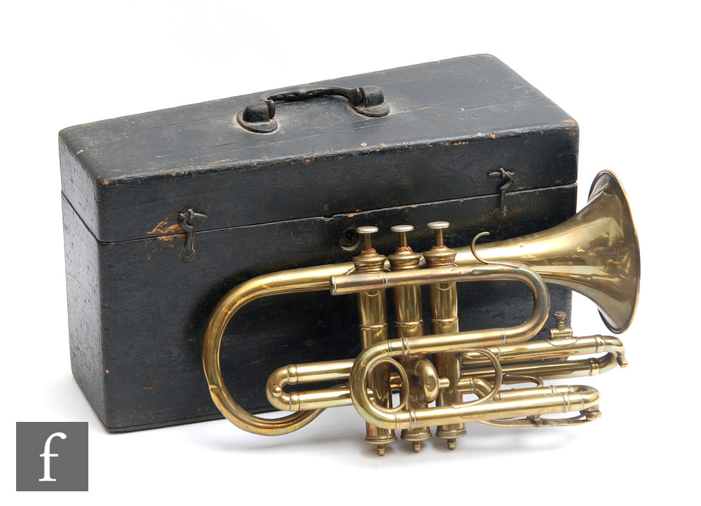 A late 19th or early 20th Century brass trumpet by R.De Lacey Brixton London, with mouth pieces