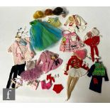A collection of assorted 1960s Barbie fashions and accessories, comprising a Fashion Queen Barbie