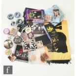 A collection of Beatles memorabilia to include The Beatles hair pomade, stamps, a John Lennon scarf,