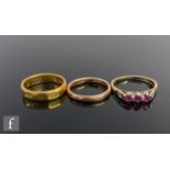 A 22ct wedding ring, weight 5.9g, with a 9ct example, weight 2.2g, and a 9ct three stone ruby