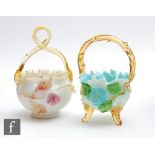 A late 19th Century glass posy basket of footed ovoid form in opal glass with applied amber trim and