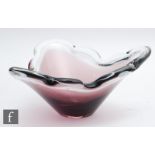 A contemporary studio glass bowl of triform with cloud shaped rim, with an amethyst core cased in