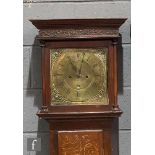 An 18th Century oak and mahogany cross-banded longcase clock with an eight day movement, the hood