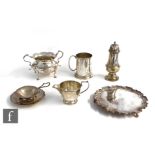 Six hallmarked silver items to include a small modern card waiter, a sugar basin, a small tankard, a