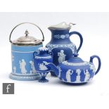 Four pieces of late 19th to early 20th Century Wedgwood jasperware comprising a biscuit barrel, a