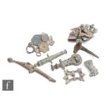 Various metal detecting finds to include a Roman fantail brooch, a Polden Hill dolphin brooch and