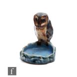 An early 20th Century Royal Doulton Lambeth pin or trinket dish modelled as an owl perched on a