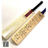 A Gloucester signed County Cricket Club bat and a Grey Nicolls indistinctly signed cricket bat. (2)