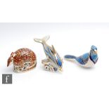 Three boxed Royal Crown Derby paperweights comprising an Armadillo, Blue Jay and Striped Dolphin,