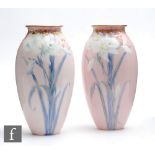 A pair of early 20th Century Doulton Burslem Art Nouveau vases each decorated with pate sur pate