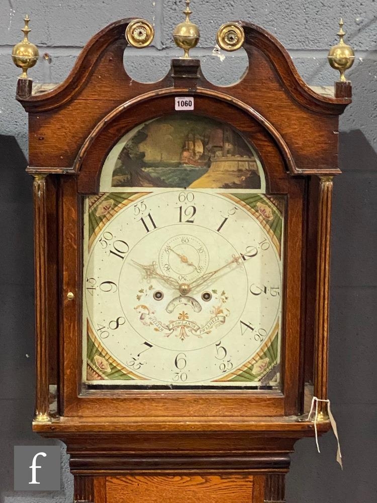 An early 19th Century oak longcase clock with an eight day movement striking on a bell, the case