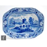 A 19th Century blue and white meat plate or well and tree carving dish, decorated with a rural