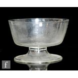 An 18th Century small punch bowl of circular form raised to an integral stem and folded foot,