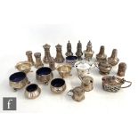 Twenty three assorted hallmarked silver condiments to include mustard and pepper pots, open salts