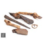 A collection of Roman Iberian Legionnaires equipment to include three iron pickaxe heads, a spike, a