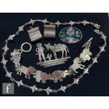 Five items of Mexican silver jewellery to include a necklet, bracelet, two brooches and a pair of