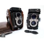 Two mid 1960s Yashica-24 TLR cameras, serial numbers L7110912 and L8070147, each fitted with