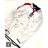 An England football shirt, 2004/2005 season, signed by various players in black ink to include
