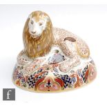 A boxed Royal Crown Derby paperweight Lion, gold stopper.