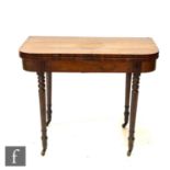 A George IV rosewood D shaped fold over card table, on ring turned legs, 76cm x 91cm.
